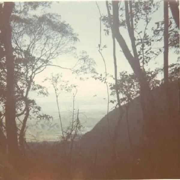 Soldier walking down mountain enjoying scenery