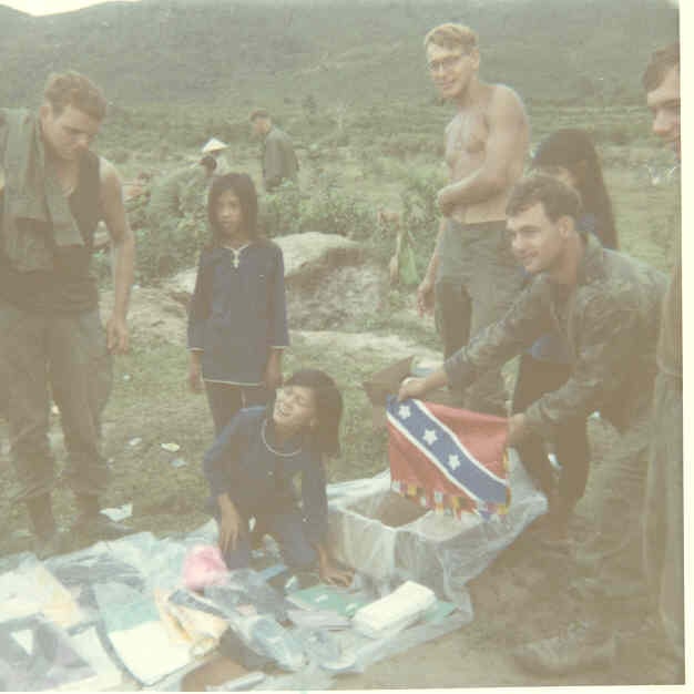 Soldiers buying sodas from young merchants on Highway 1