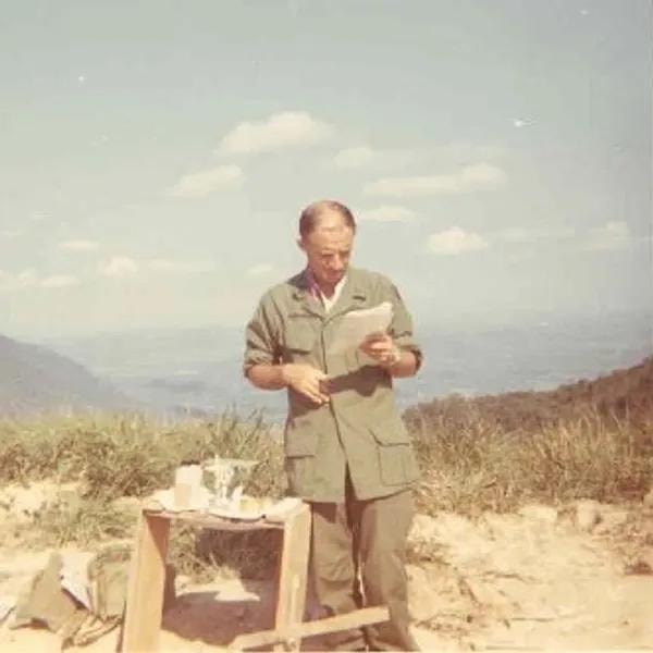 Priest saying Mass in the field