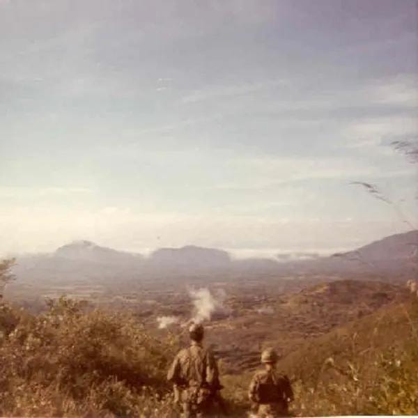 Smoke from rockets beside Vietnamese interpreter